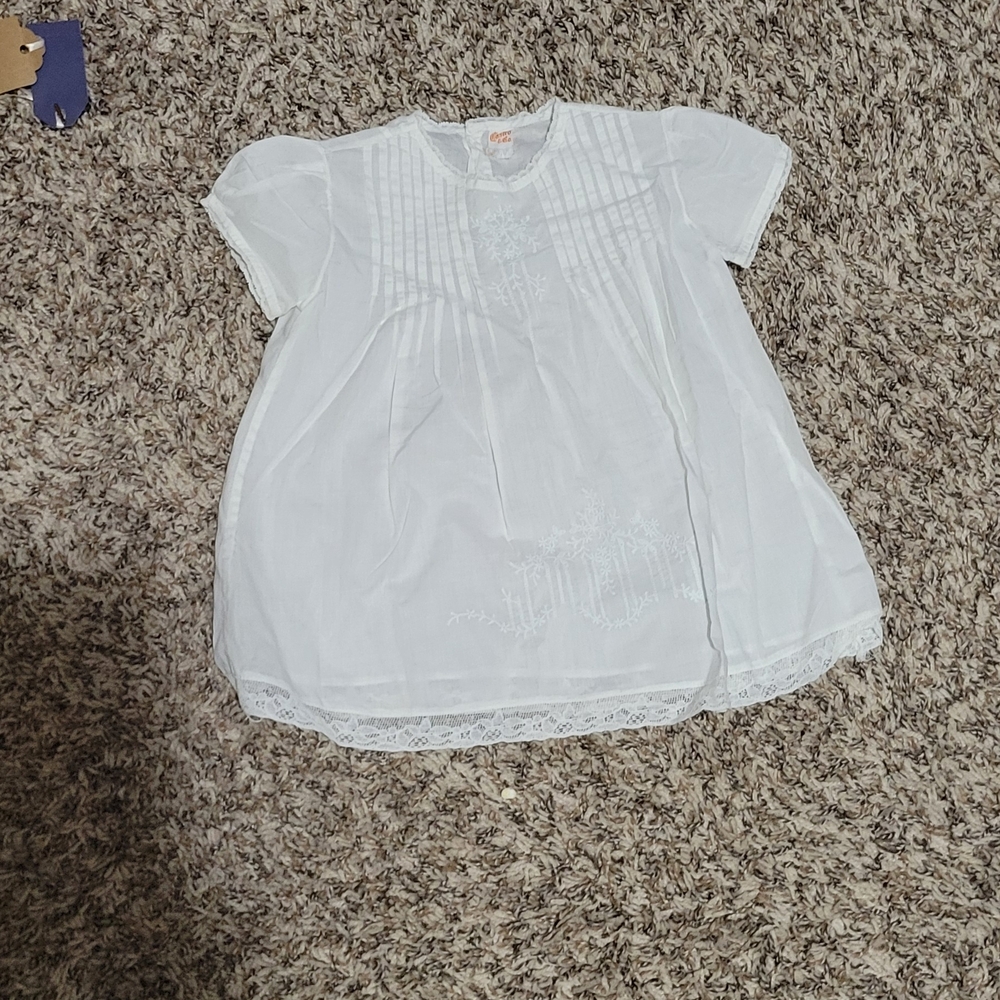 Charming White Kids Blouse with Lace Detail And Button Back.